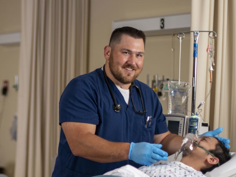 Nurse attending to patient.