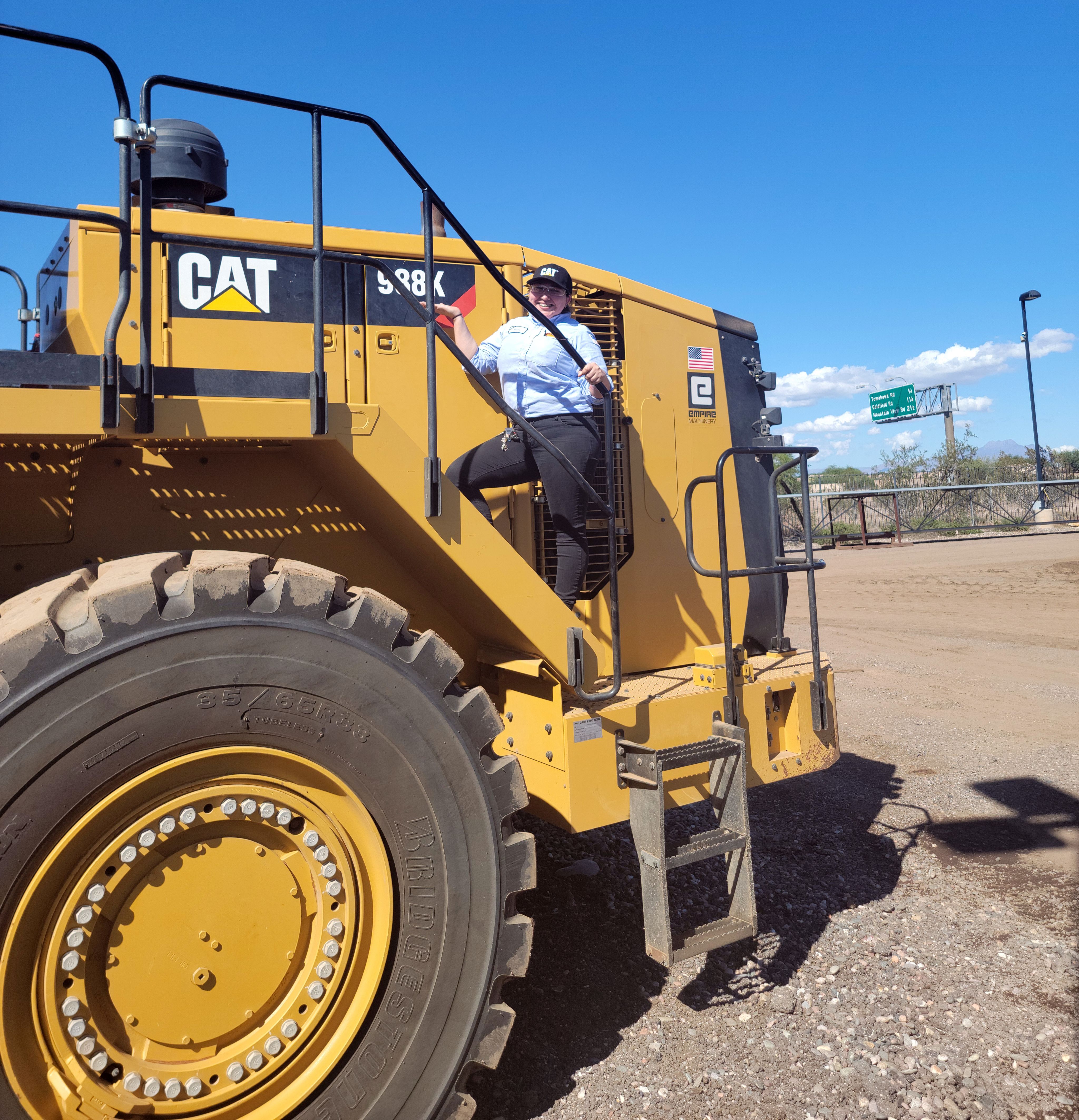 Women on big construction bulldozer