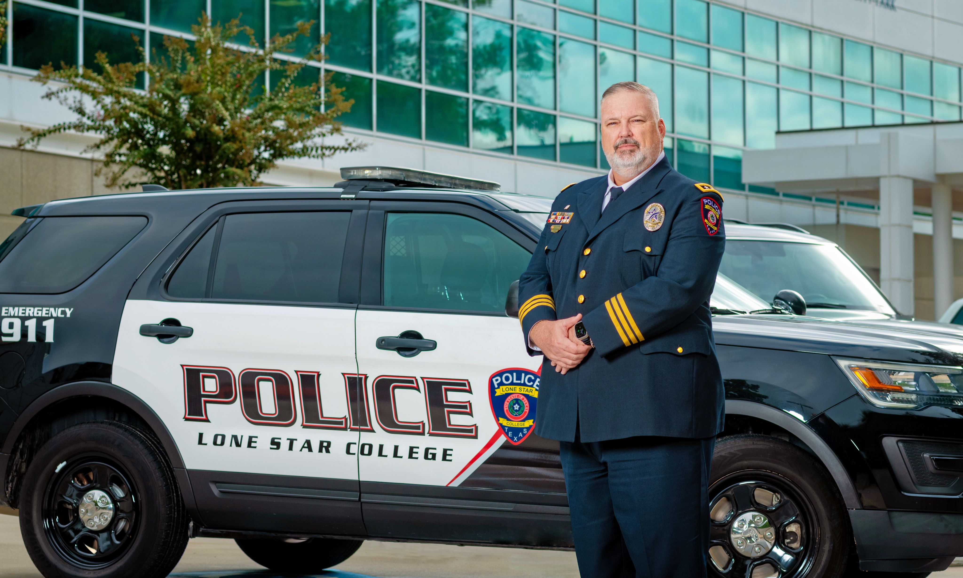 LSC PD chief with patrol car.